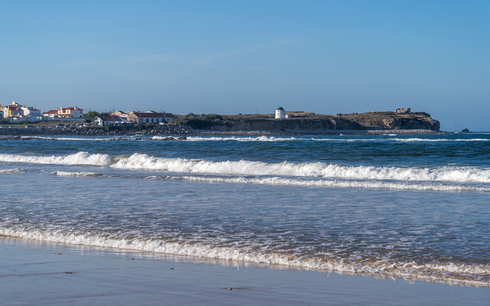 Peniche seen across the waves from Praia da Gamboa