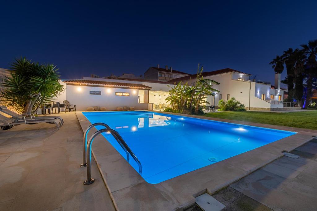 Illuminated pool and garden at Silver Seahorse Garden Retreat