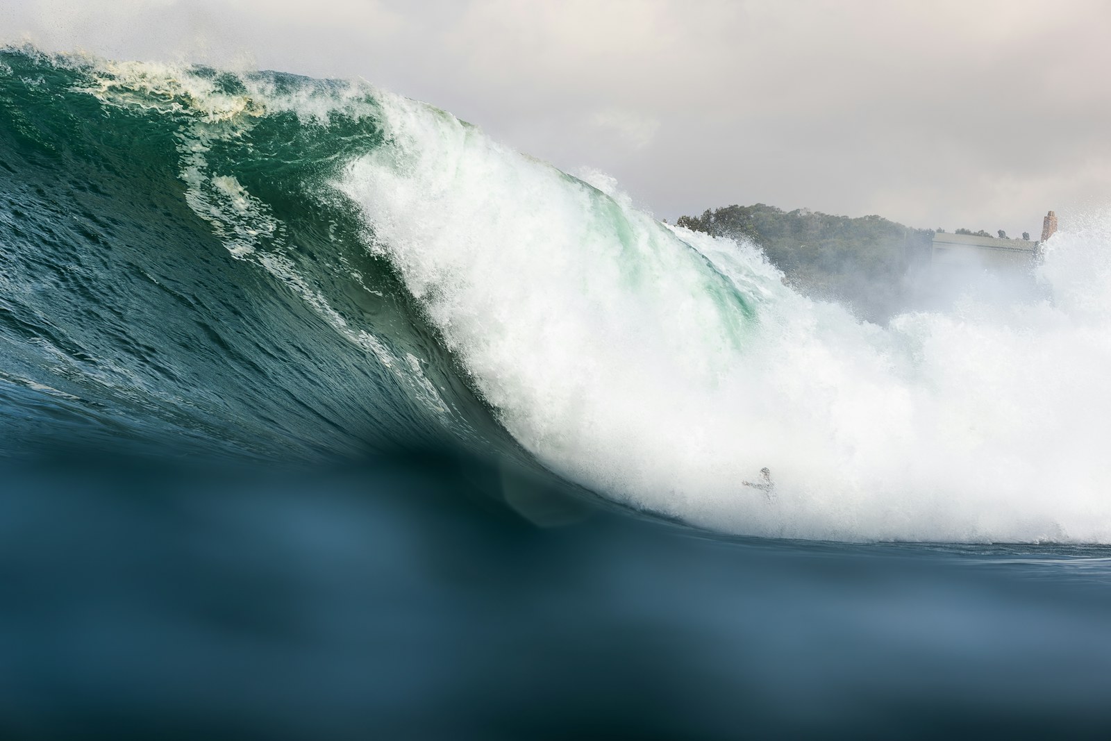 Powerful breaking wave at Supertubos beach in Peniche
