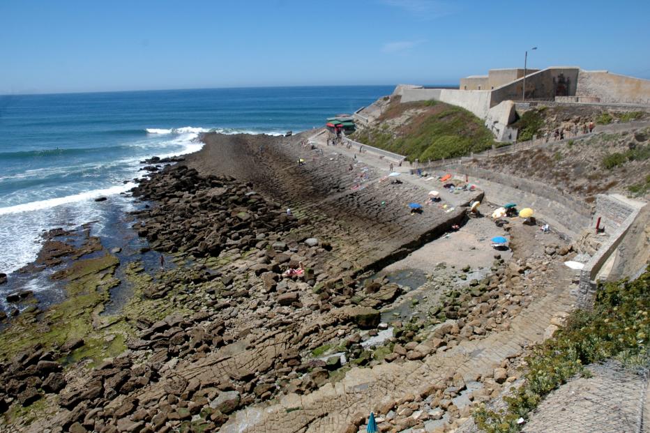 Rocky bathing area below the fort at Praia da Consolação