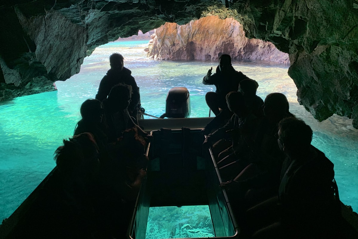 Glass-bottom cave boat inside a Berlengas sea cave