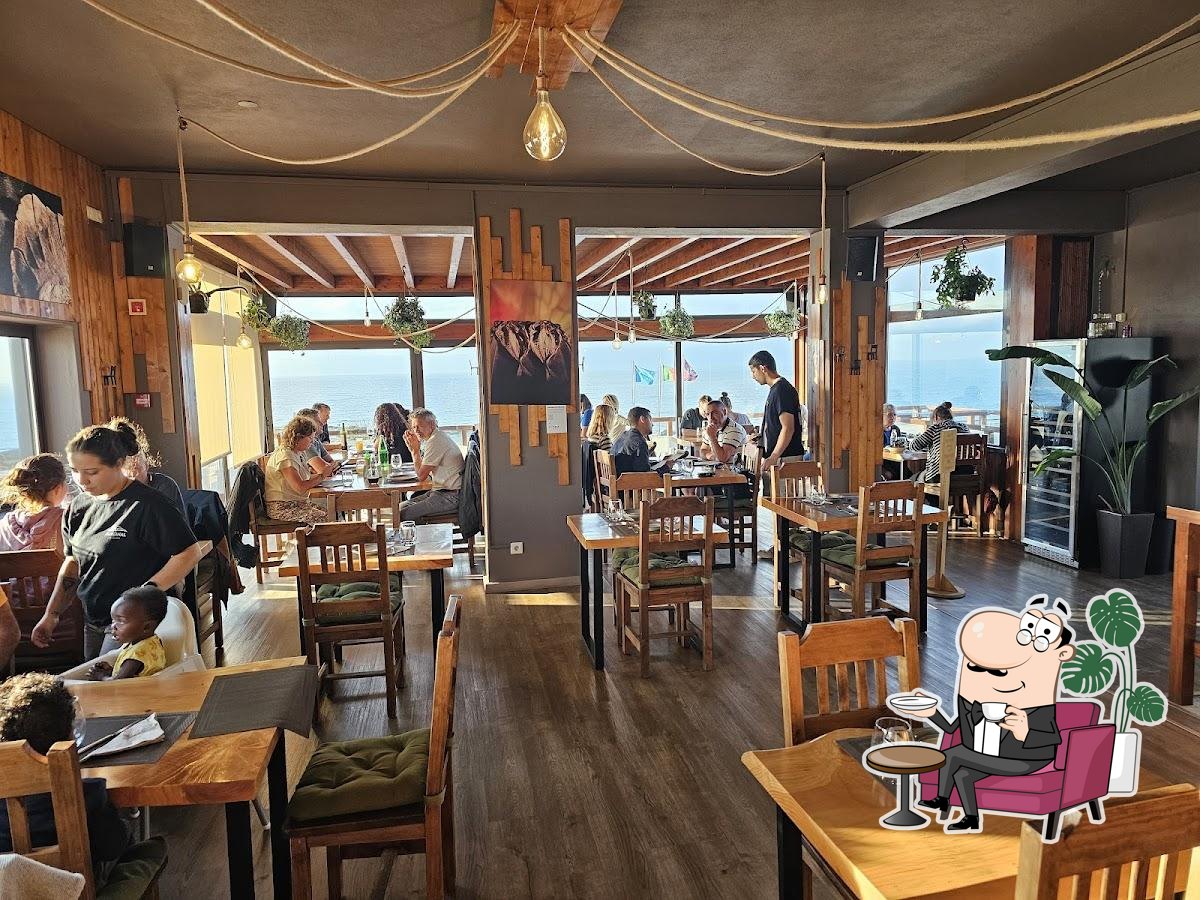 Dining room with Atlantic views at Marginal in Peniche